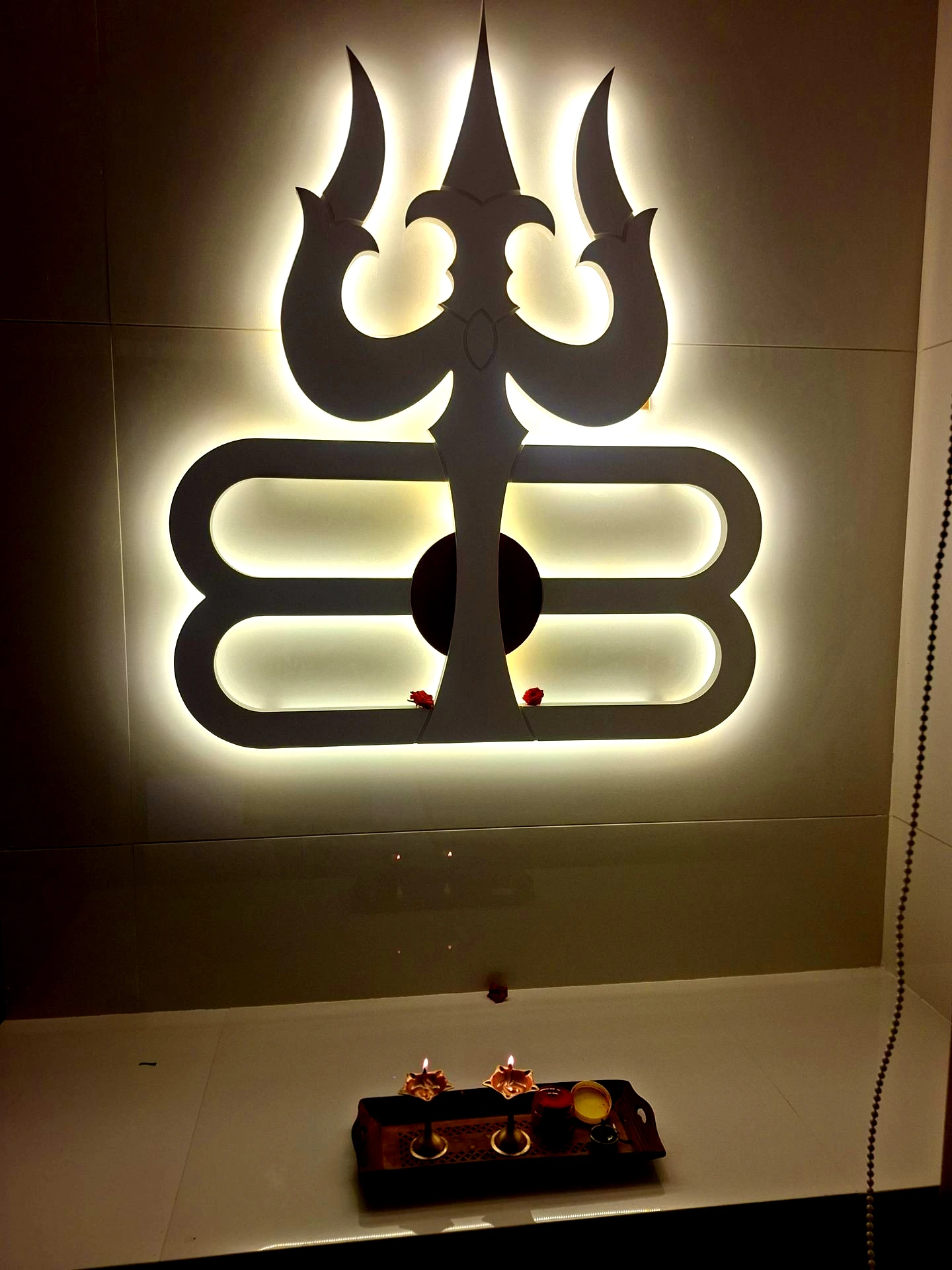 Illuminated Mahadev symbol in our new home temple