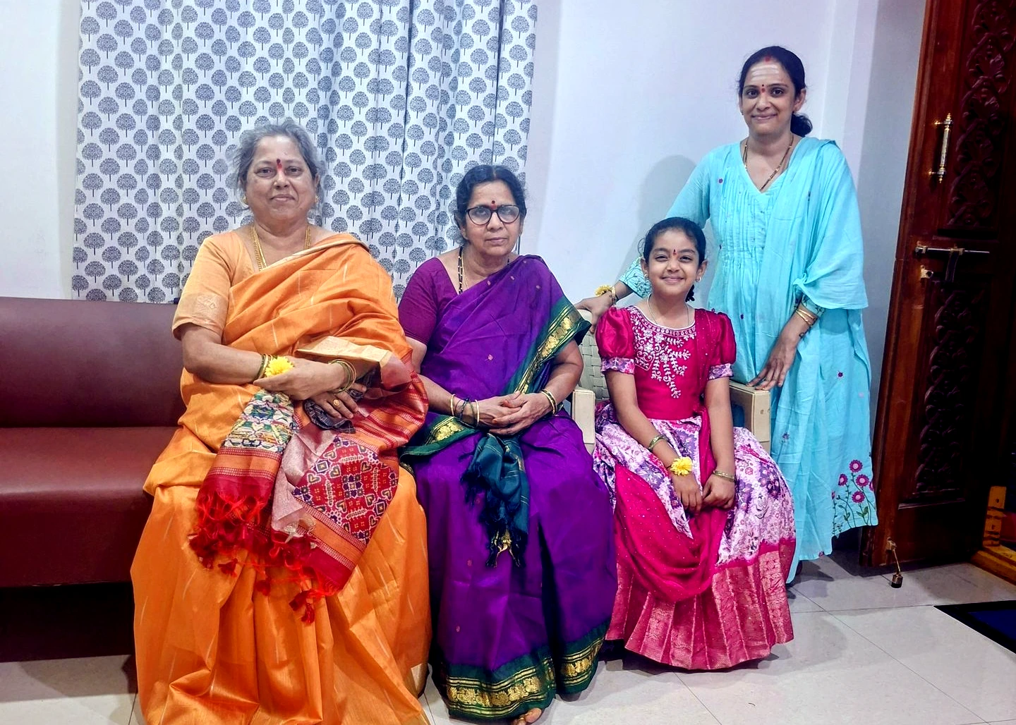 Family celebrating Varalakshmi Puja in our new home